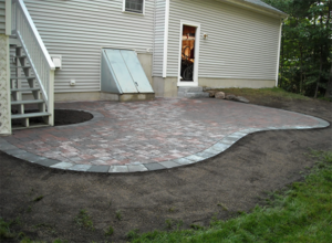 Curved patio in NH by DeJohn Landscaping.png