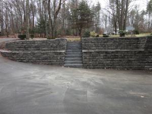 Retaining walls with granite stairs at Bow NH home.png