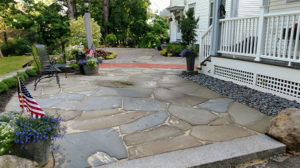Rustic stone patio designed by Dave Dejohn for a Concord NH home