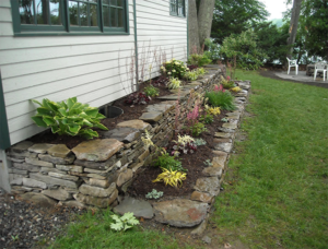 Stone retaining wall with garden