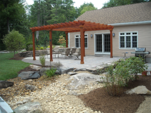 Zen patio with pergola in Concord New Hampshire by Dave Dejohn Landscaping