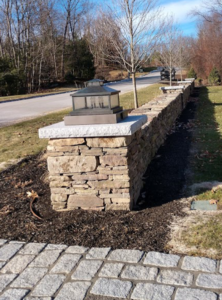 Freestanding Fieldstone wall with Columns and Granite caps