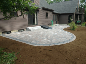 DeJohn Landscaping installs a paver patio in this Bow NH backyard